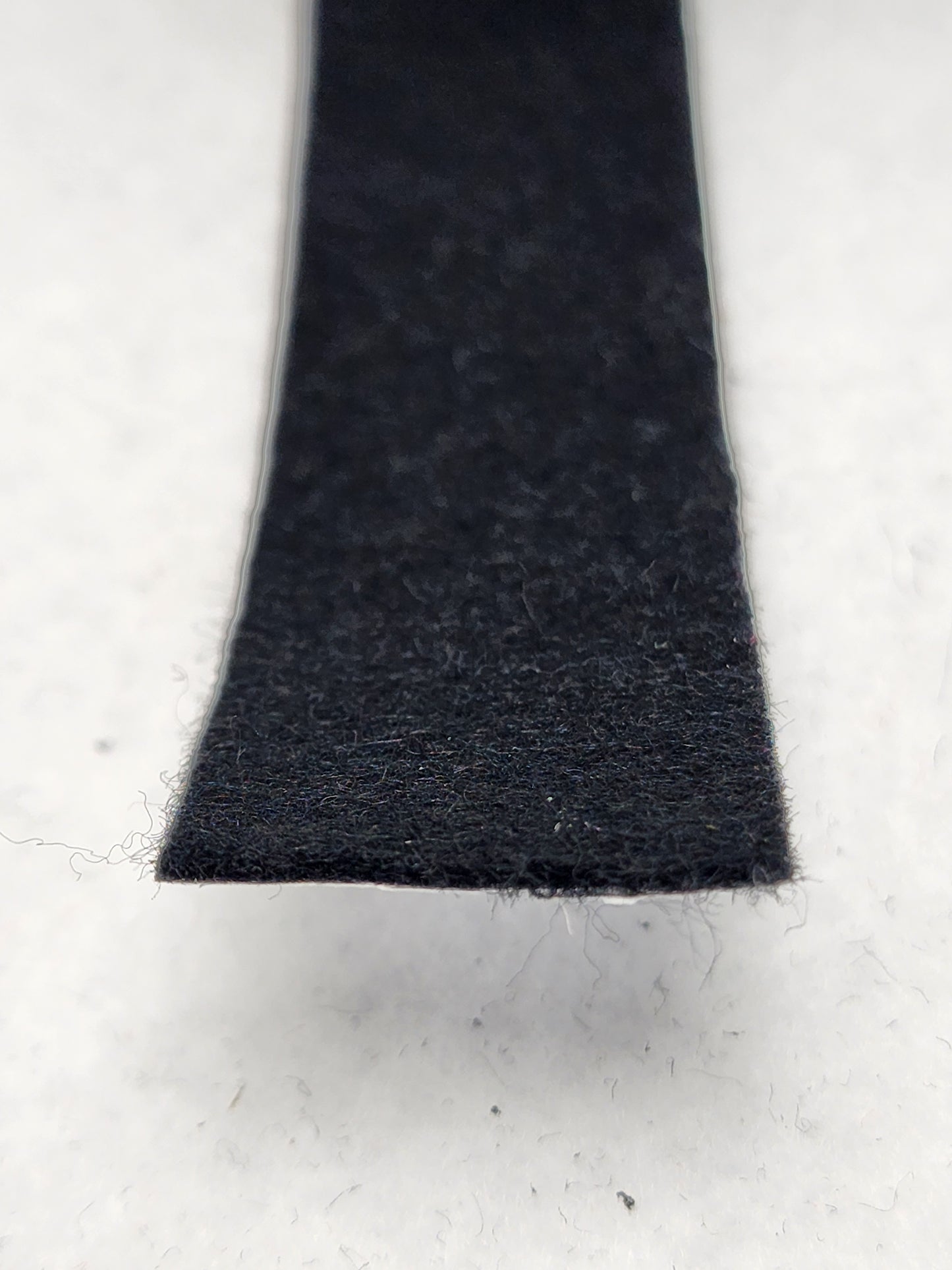 Black felt stripping with adhesive